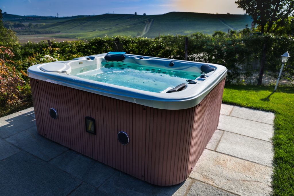A hot tub in a scenic backyard